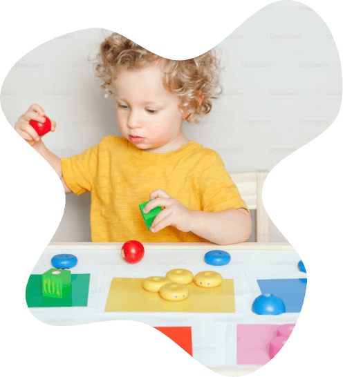 Child playing with developmental toys